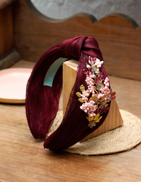 Guest headband with sinamay knot and floral details