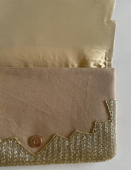 Pochette en strass doré pour les invités