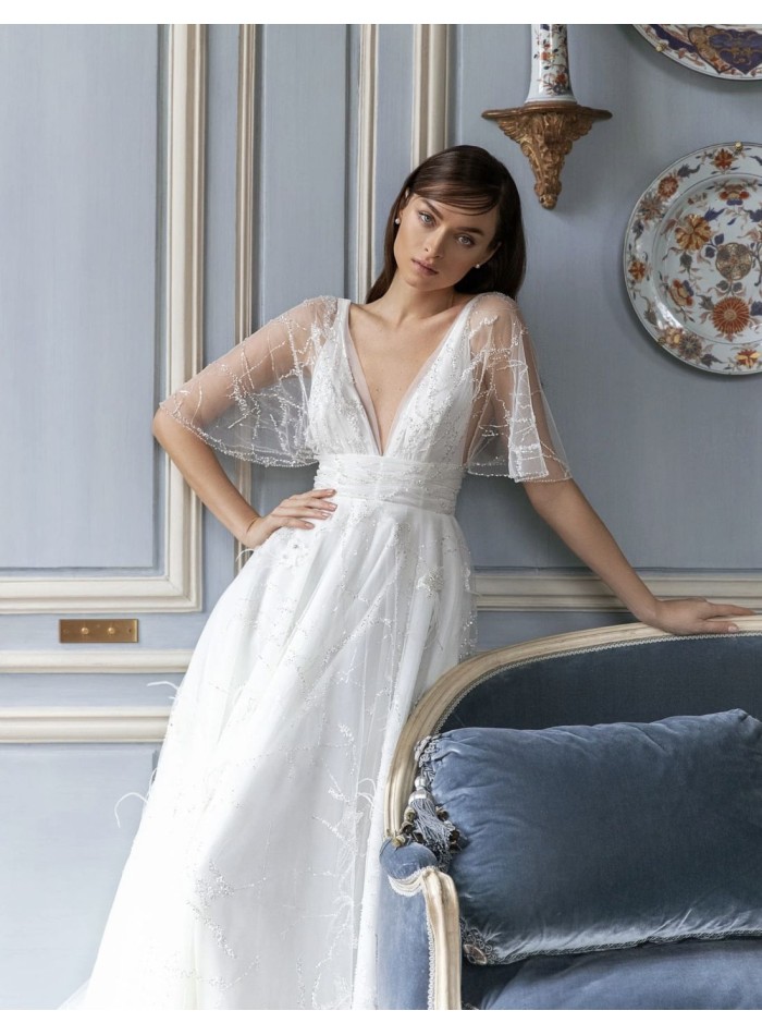 Wedding dress with sheer short sleeves and...