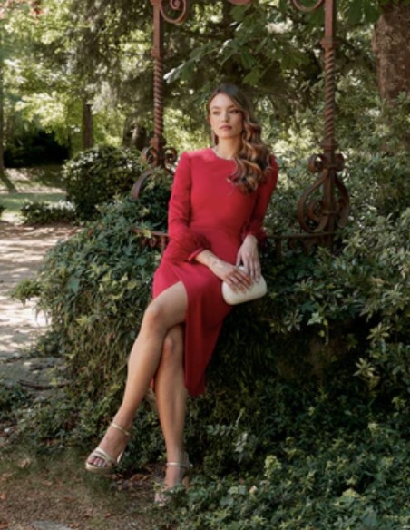 Long sleeved cross over cocktail dress with feathers