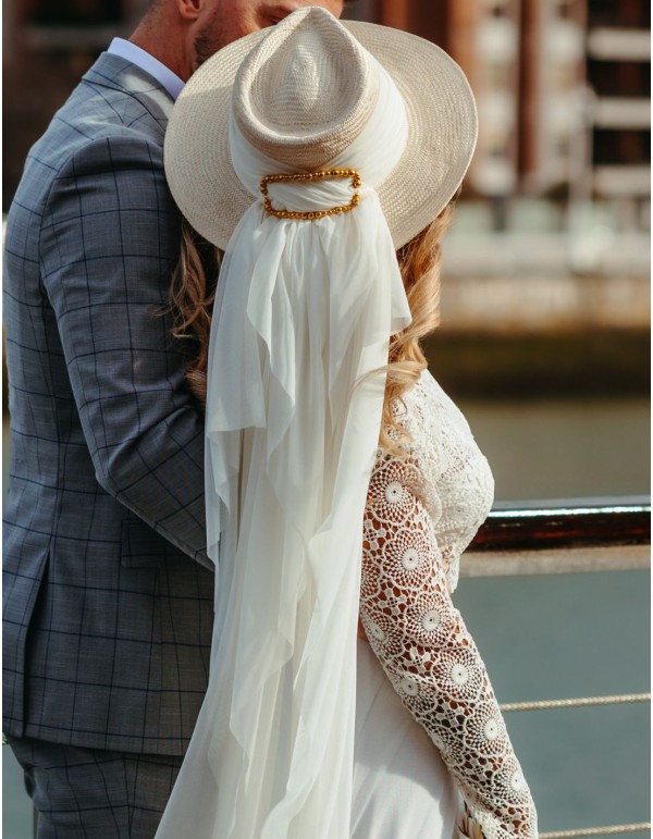Bridal or guest hat with veil and ball buckle. 2