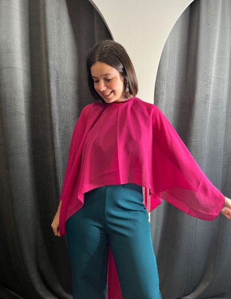 Multiposition chiffon cape in fuchsia color.