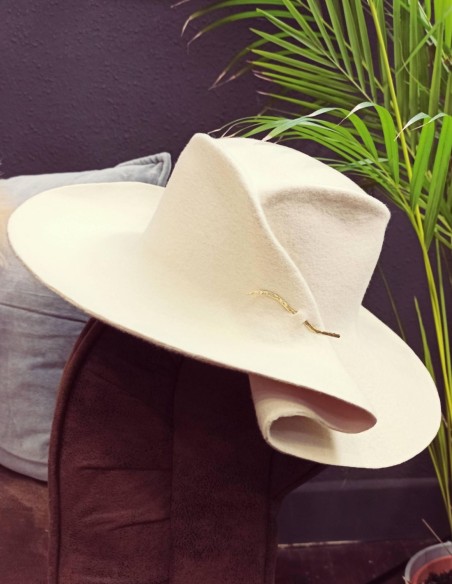 White wool hat with pleat and ruffle.