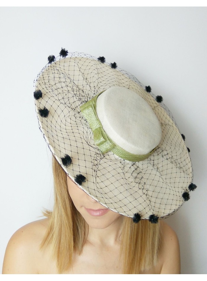 Guest pamela with green bow and black veil.