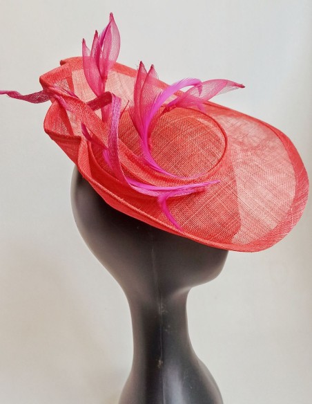 Feathered brim headpiece with feathers and flowers in pink.