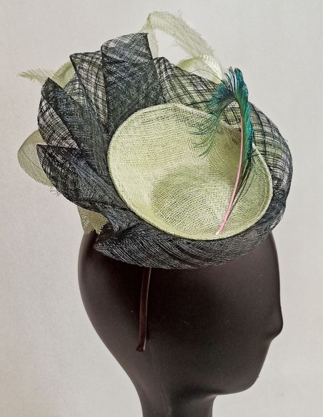 Riffle headpiece with peacock feather.