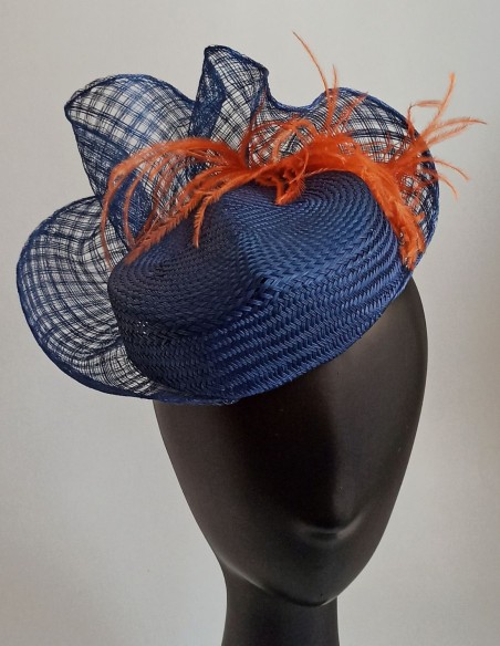 Handmade curved headdress with orange feathers.