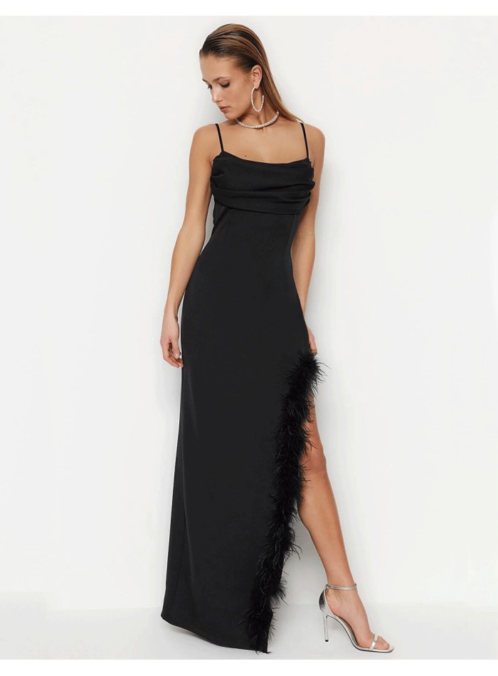 Black evening dress with feathered slit
