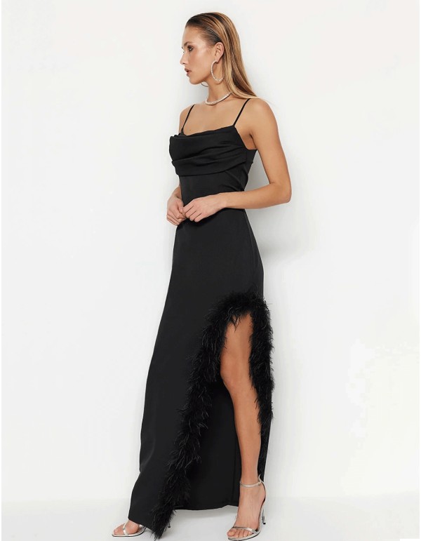 Long party dress with feathers in the opening. 2