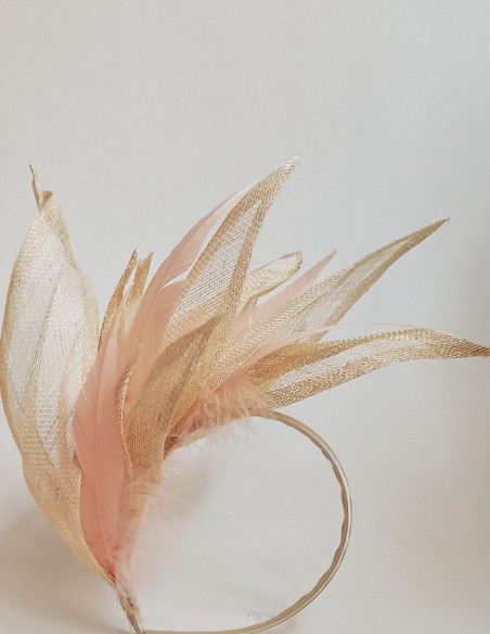 Intertwined raffia leaves and feathers headpiece.