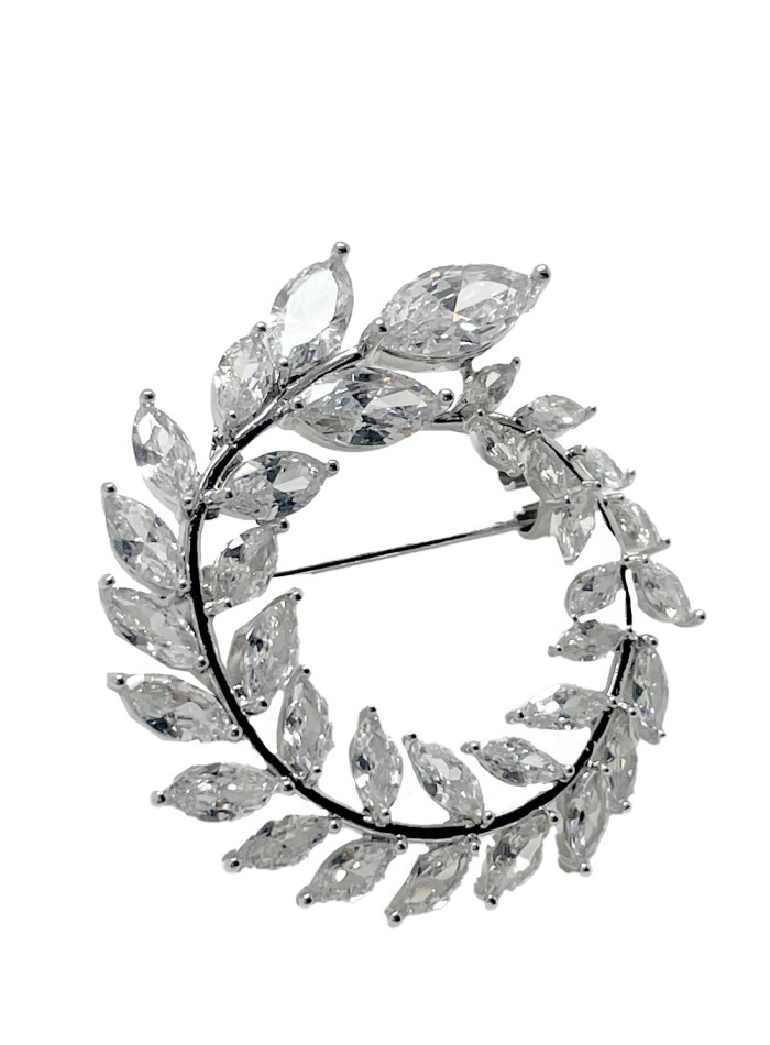 Broche ronde argentée avec cristaux en forme de...