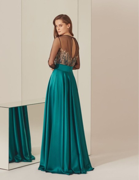 Turquoise rhinestone bodysuit and satin long skirt