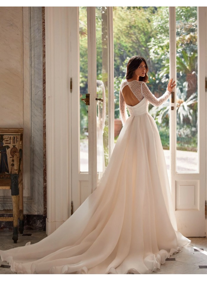 Long wedding dress with straight neckline and...