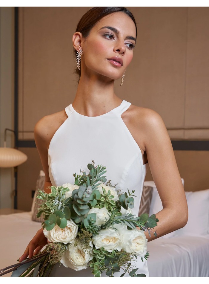 Long wedding dress with halter neckline and...