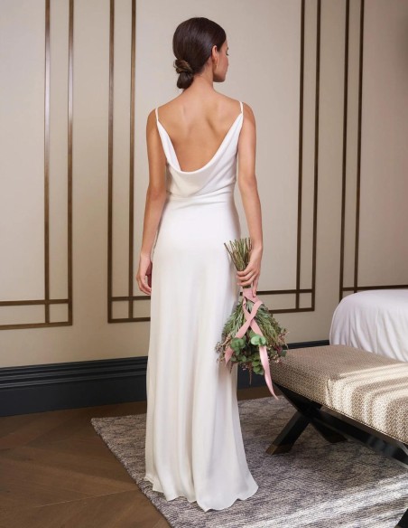 Long satin wedding dress with thin straps.