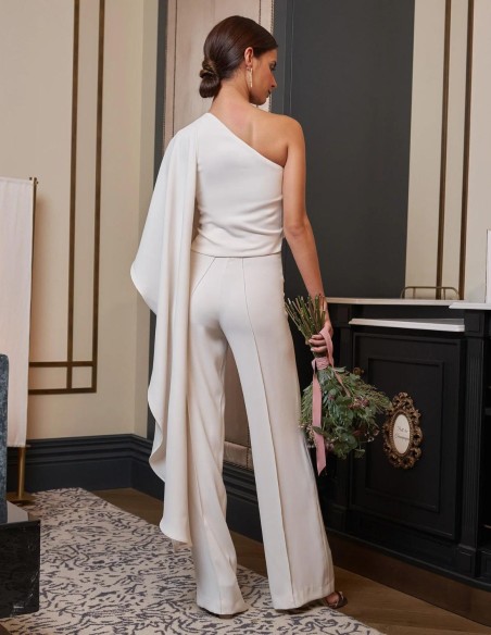 White flared trousers to match the top.