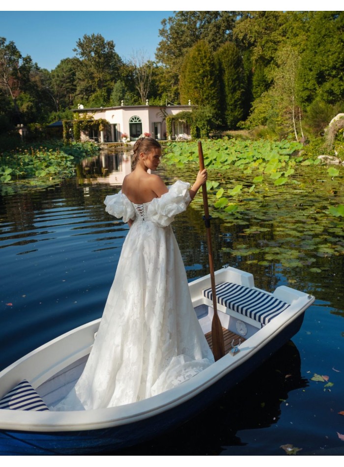 Ivory A-line wedding dress with a straight...