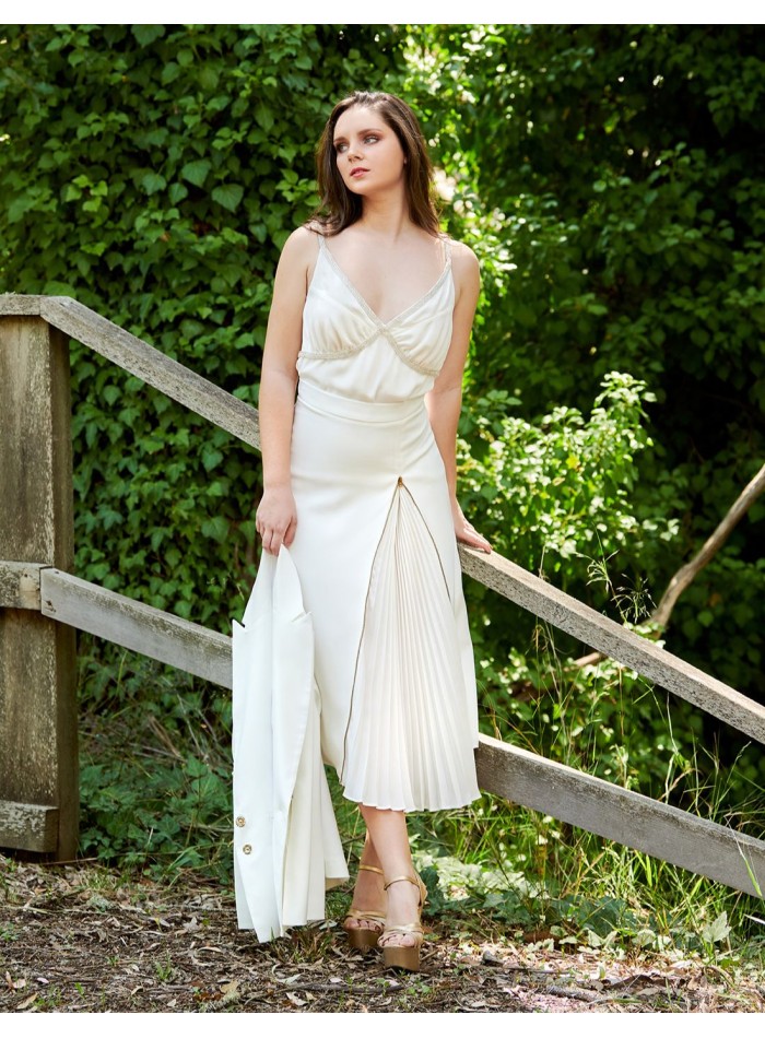 White pleated midi skirt.