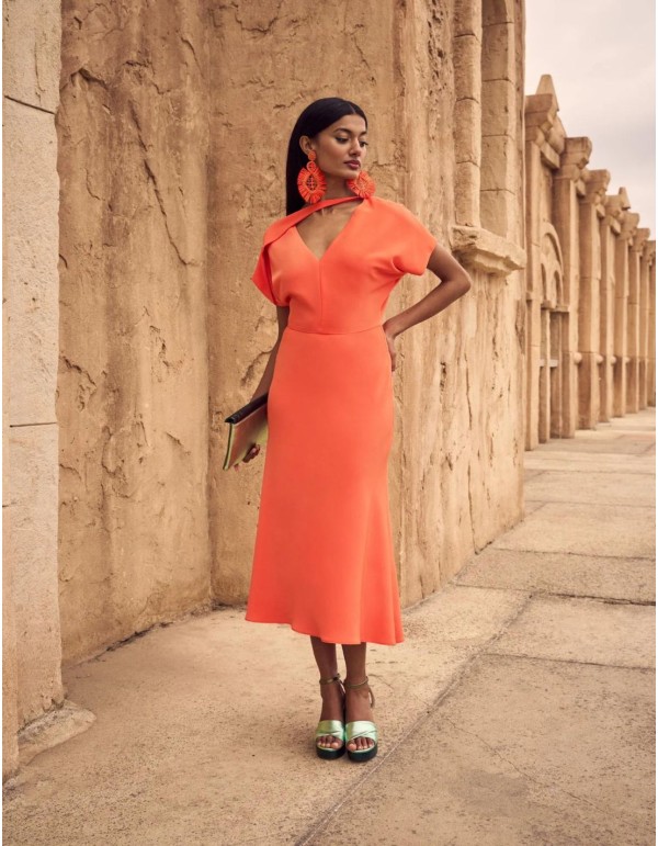 Orange midi party dress for guests.
