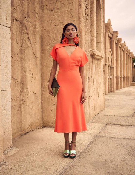 Midi party dress with asymmetric neckline.