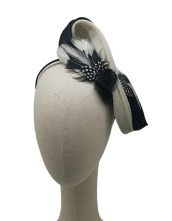 Black and white lace headdress with feather appliqués