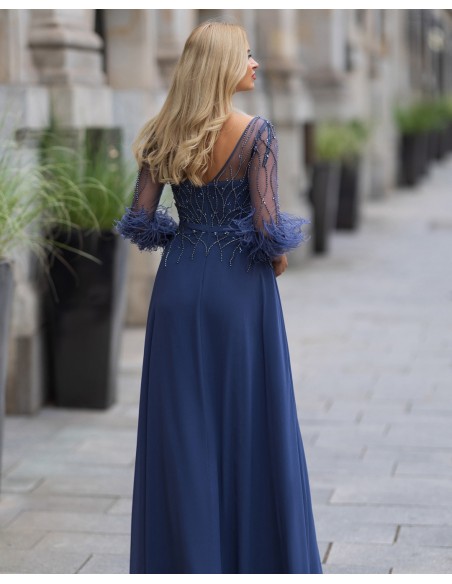 Long party dress with feather appliqués and rhinestones