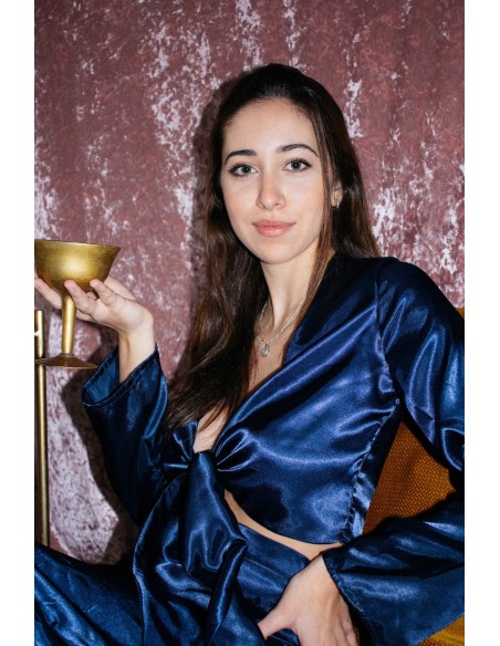 Navy blue satin blouse with knotted neckline and long sleeves