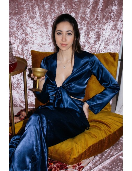 Navy blue satin blouse with knotted neckline and long sleeves