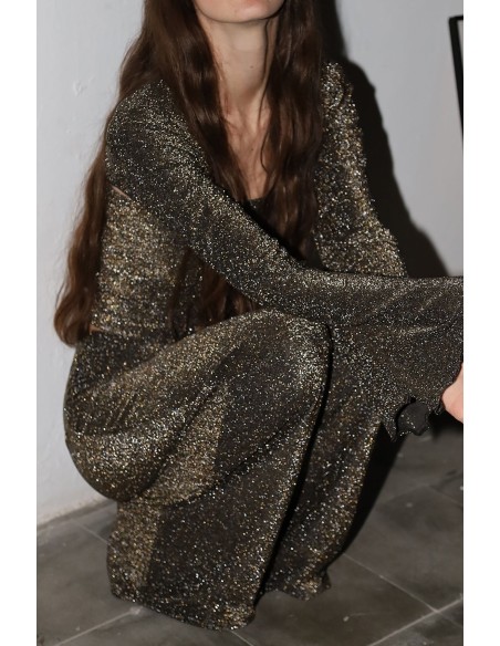 Pantalon de fête long et évasé avec des paillettes dorées