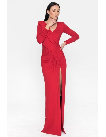 Long red party dress with long sleeves and a slit in the skirt