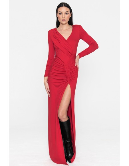 Long red party dress with long sleeves and a slit in the skirt
