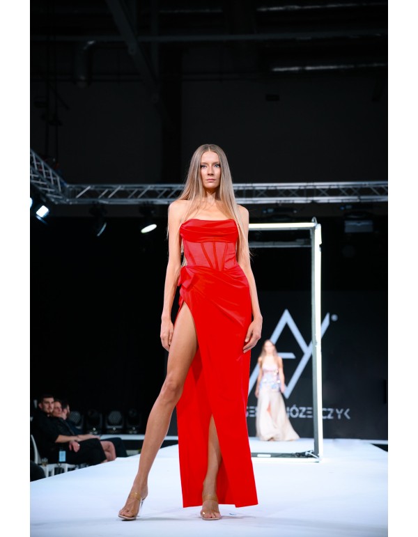 long ball gown featuring a strapless neckline, slit and...