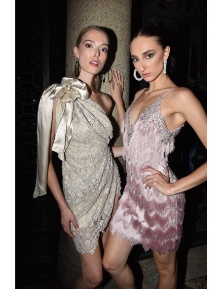 Asymmetrical couture dress with bow and floral embroidery in cream