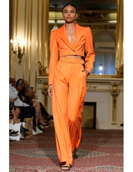 Short orange blazer with long, puffed sleeves