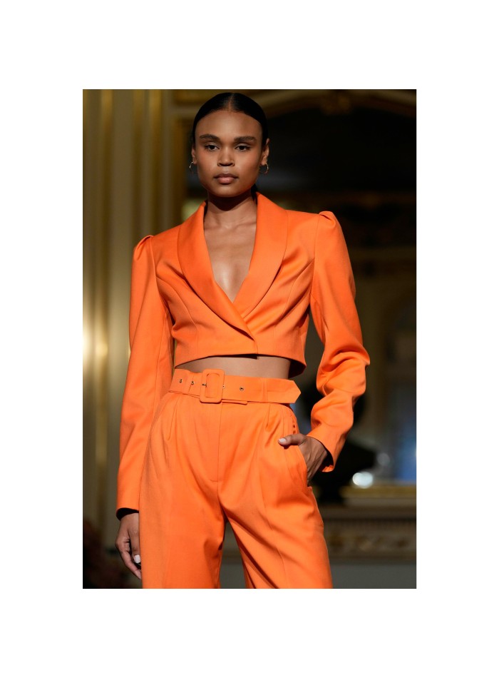 Short orange blazer with long, puffed sleeves