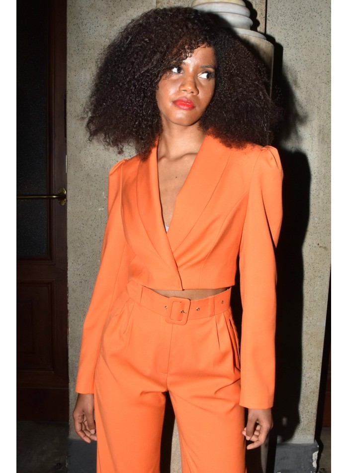 Short orange blazer with long, puffed sleeves