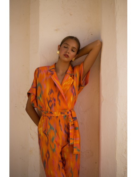 Printed party jumpsuit with raglan sleeves and tuxedo neckline