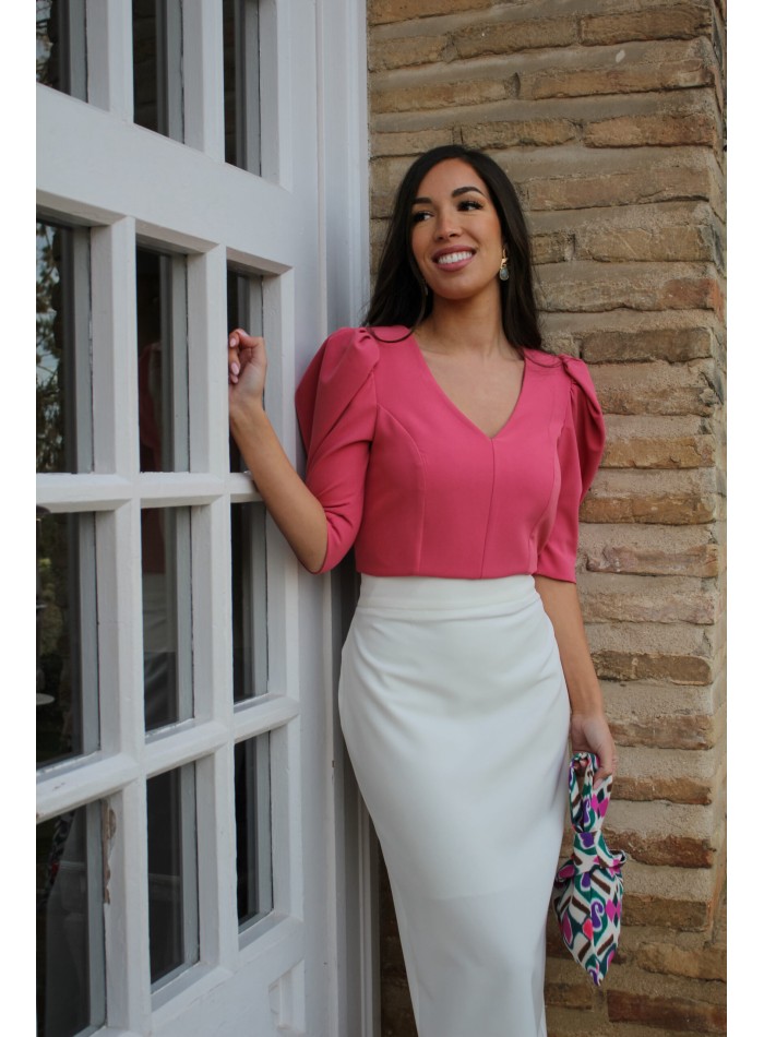 Coral party top with puffed sleeves and V-neckline