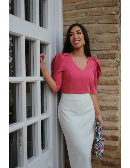Coral party top with puffed sleeves and V-neckline