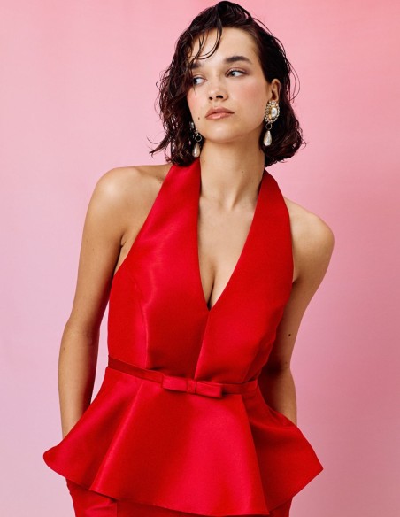 Peplum party top with halter neckline and bow