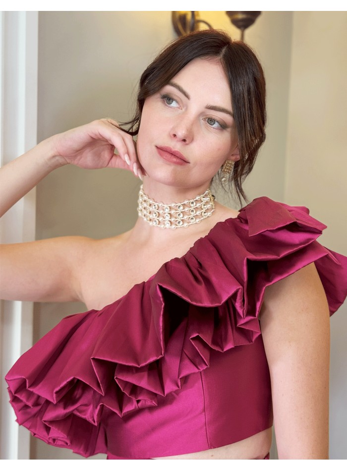 Conjunto top asimétrico con volante y pantalón largo recto