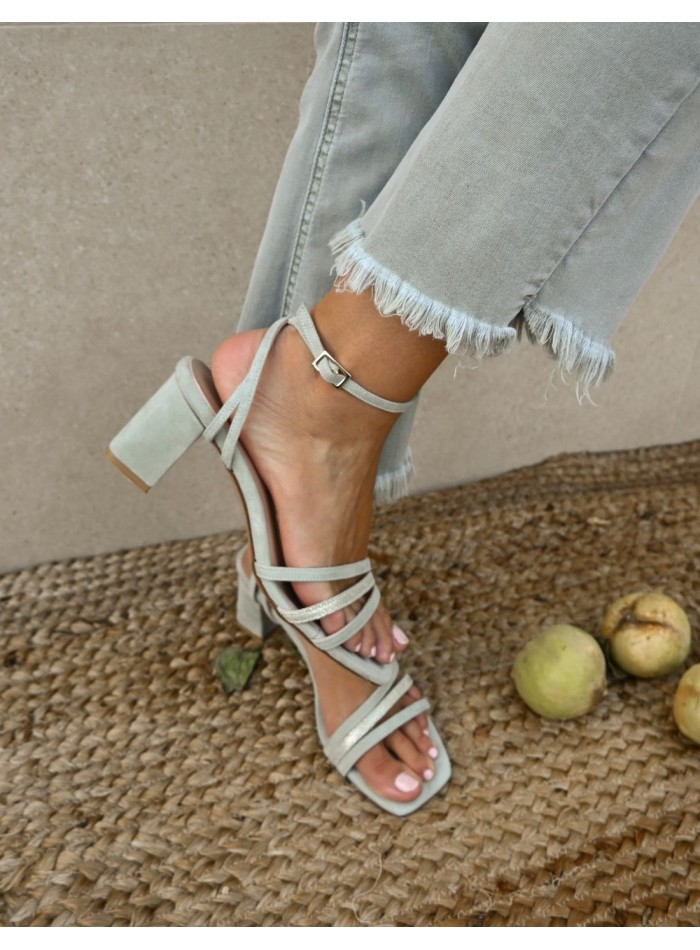 Green party sandals with straps tied to the ankle