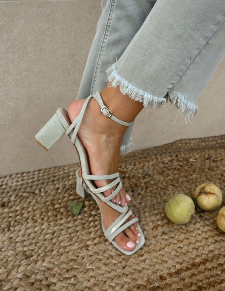 Green party sandals with straps tied to the ankle