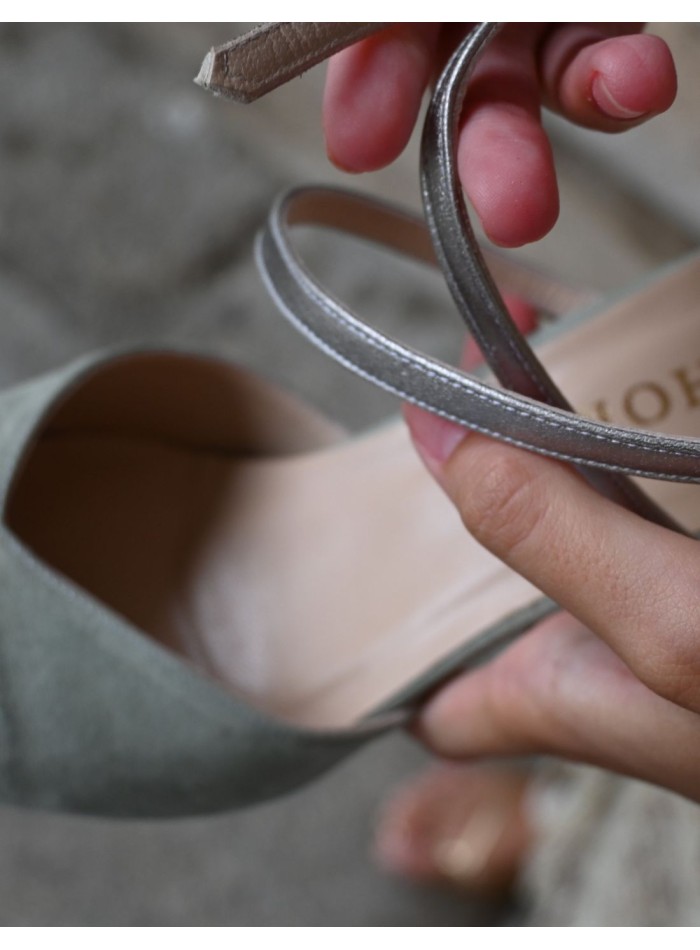 Green velvet party shoes with silver details.