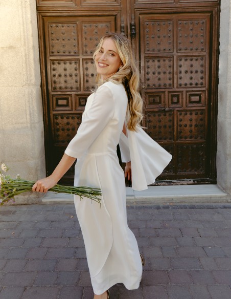 Cocktail dress with asymmetric french sleeves and cape