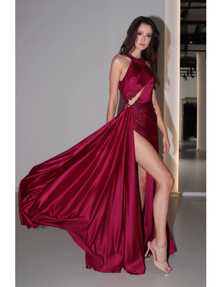 Long burgundy satin dress with slit, halter neckline and rhinestones