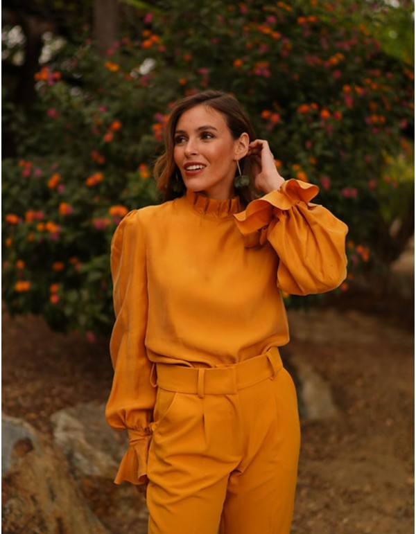 Vaporous blouse with long sleeves and mustard-colored...