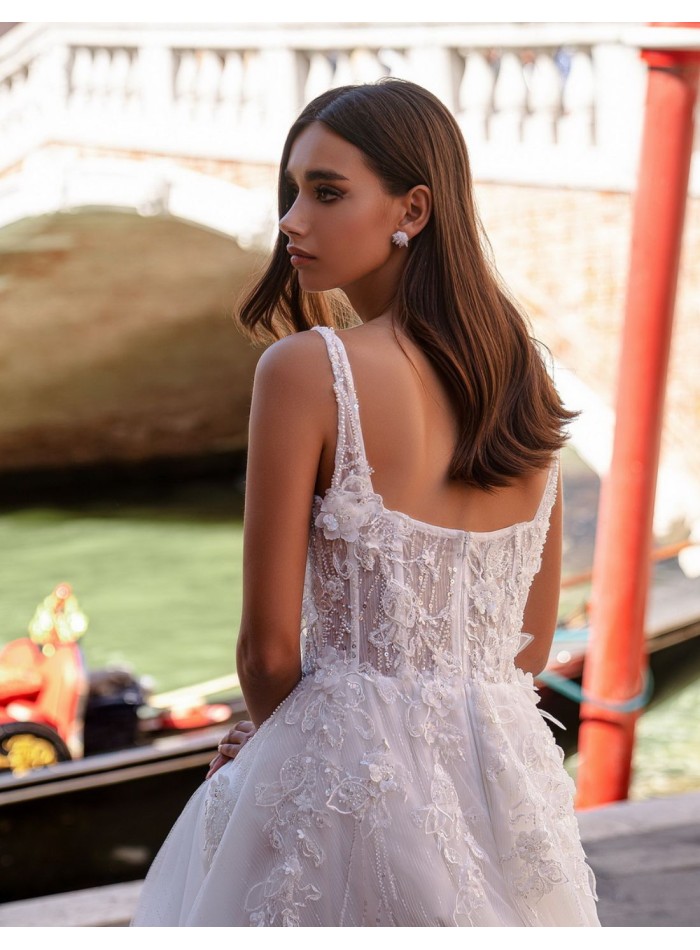 Ivory wedding dress with straps and floral...
