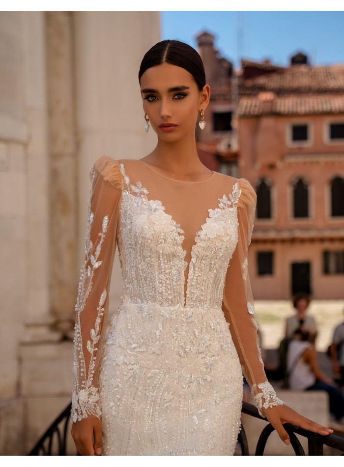 Long wedding dress with long sleeves and lace...