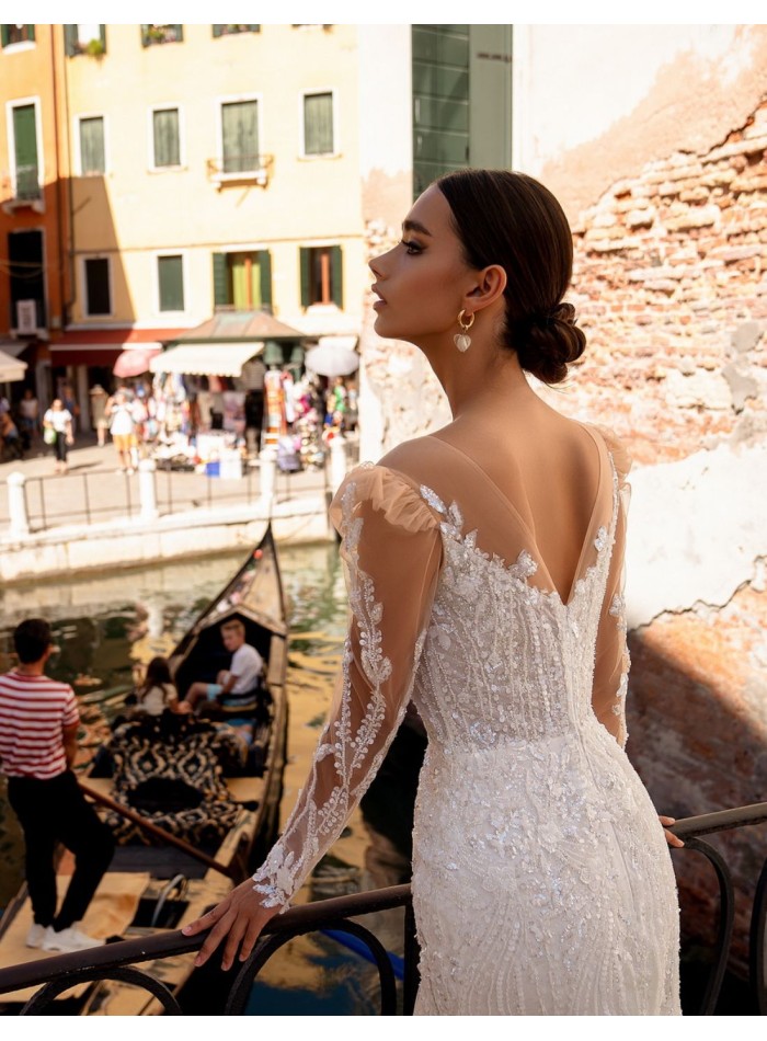 Long wedding dress with long sleeves and lace...